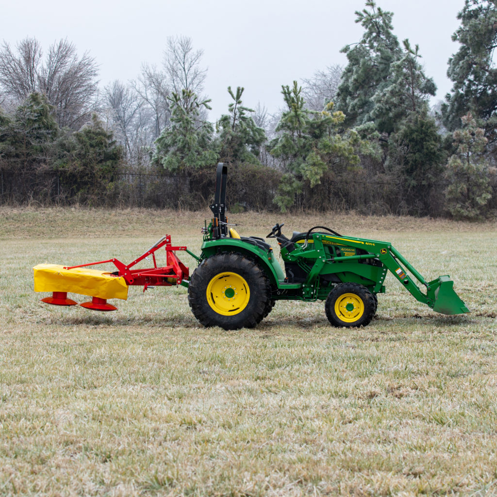 Tractor with attachment on back