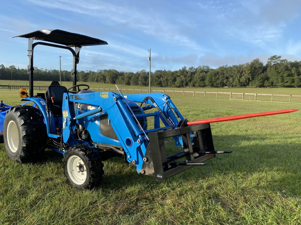 Tractor with hay bale spear