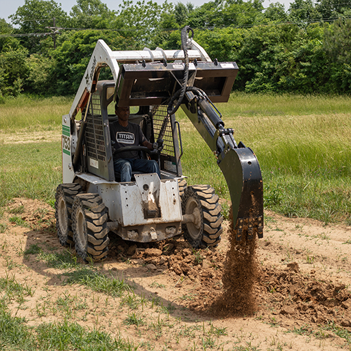 Skid steer in a field