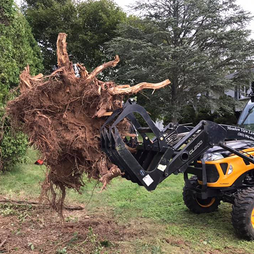 tractor pulling up a stump